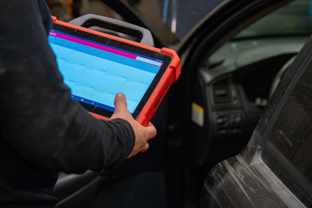 Digital Vehicle Inspection in Woodbine, MD at KIT'S Auto and Truck Repair. Image of Technician performing digital vehicle inspection