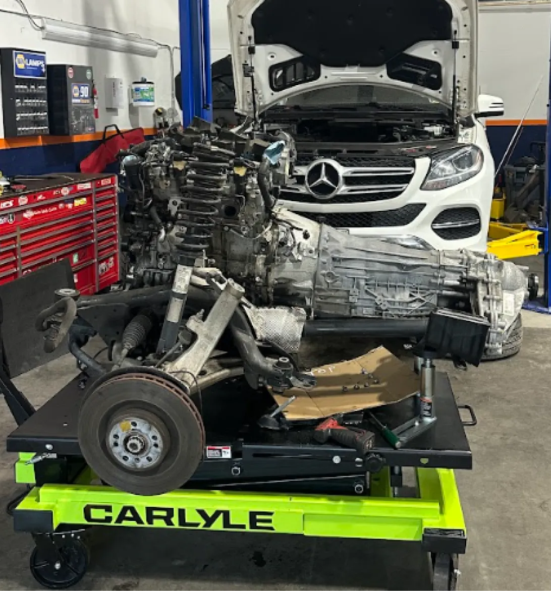 Transmission Services in Woodbine, MD At KIT'S Auto and Truck Repair. Image of an engine and transmission assembly removed for transmission services